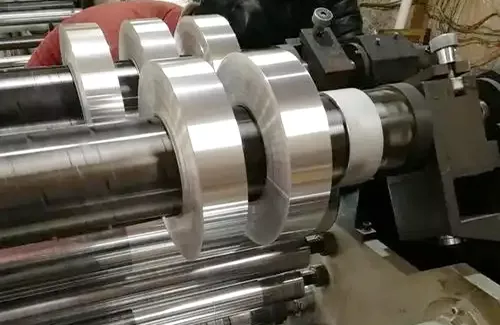 Burr-free aluminum strip edge quality for cable insulation protection